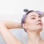 31999877-woman-applying-toner-shampoo-on-her-hair