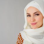 Portrait of beautiful young muslim arabian woman wearing white hijab